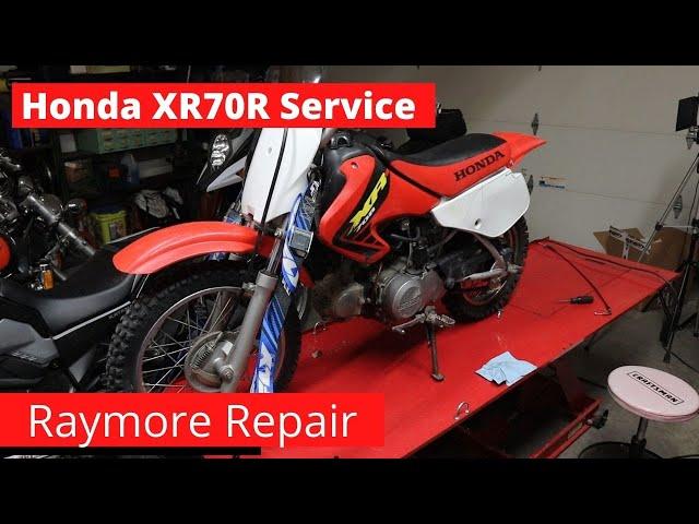 Honda 2002 XR70R Service, Valve adjust cleaning  the oil spinner and steering stem bearings.