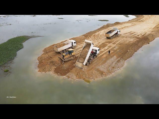 Wonderful The Best Bulldozer Pushing Soil Dump Truck Pouring Soil on Road Construction at big Lake