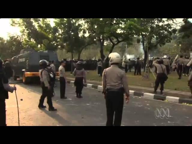 Police and protesters clash in Jakarta