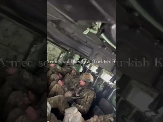 Ukrainian Armed soldiers in a Turkish Kirri MRAP