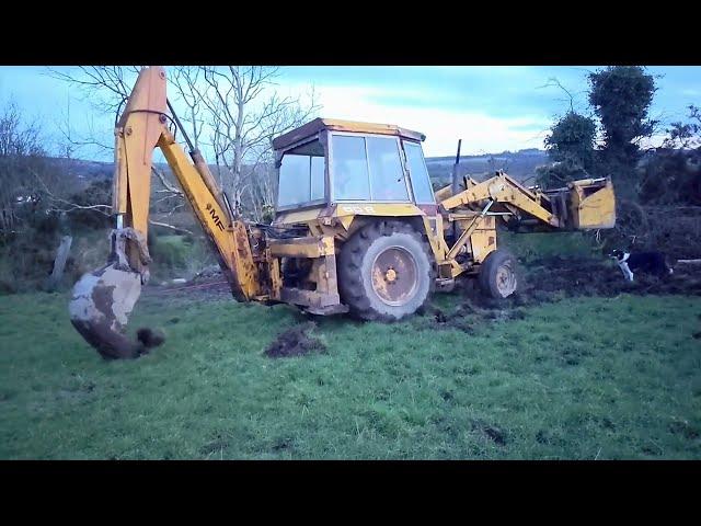 Massey Ferguson 50B getting out of a wet patch