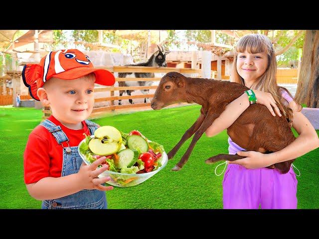 Diana Roma & Oliver nourrissent les animaux au zoo d'Emirates Park