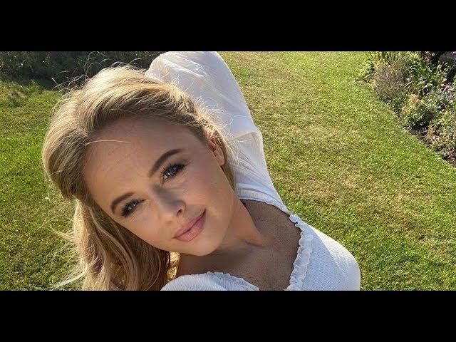 Emily Atack unleashes curves in paper-thin white dress amid crude TV confession