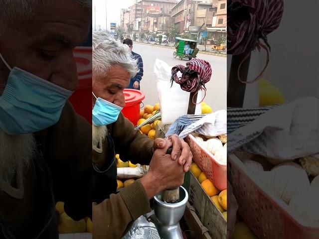 Fresh Orange Juice on the Streets of Lahore, Pakistan 