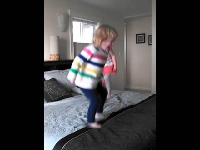 2 little monkeys (Lu & Maddy) jumping on the bed