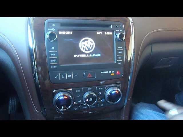 Buick's Global Interior Designer Michael Burton with the 2013 Buick Enclave