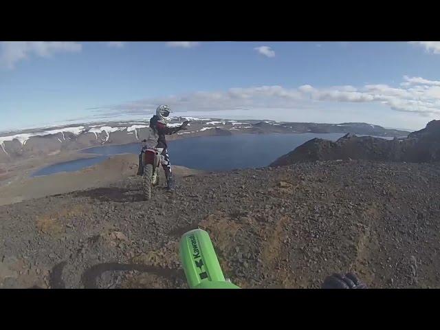 Riding enduro and motocross bike up a mountain in Iceland.
