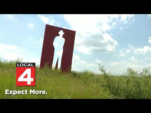 We finally know who cut down the iconic I-96 orange man sculpture