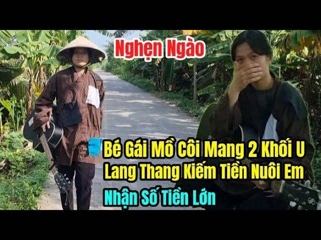 Nghẹn Ngào bé gái mồ côi mang 2 Khối u phải ôm đàn lặn lội kiếm tiền nuôi em nhận được số tiền lớn