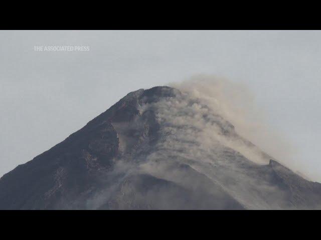 Truckloads of villagers flee as Mayon volcano erupts