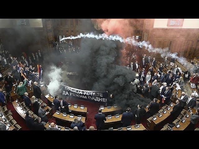 Serbia's parliament session erupts into chaos as opposition MPs set off flares and smoke grenades