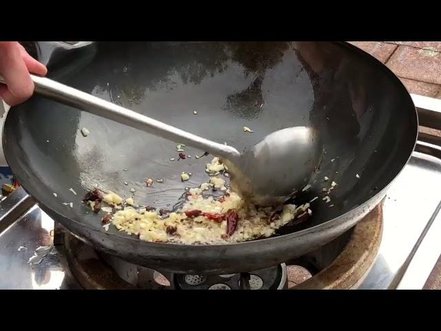 Learning how to cook with a wok (Kung Pao chicken)