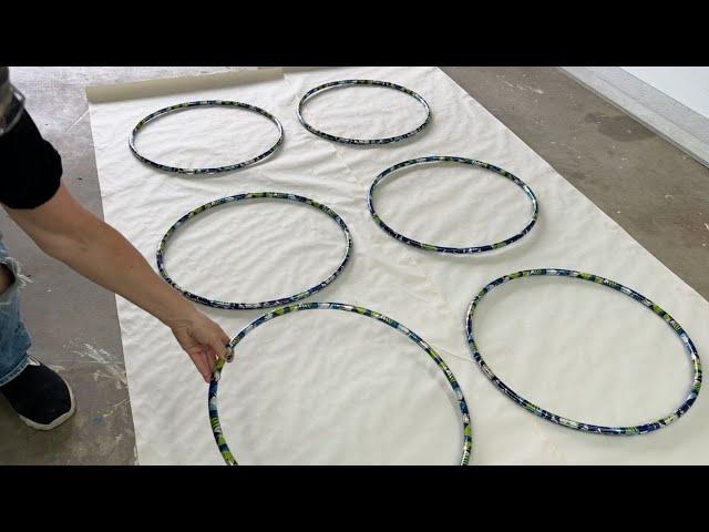 She lays 6 hula hoops on the ground for this BRILLIANT porch idea!