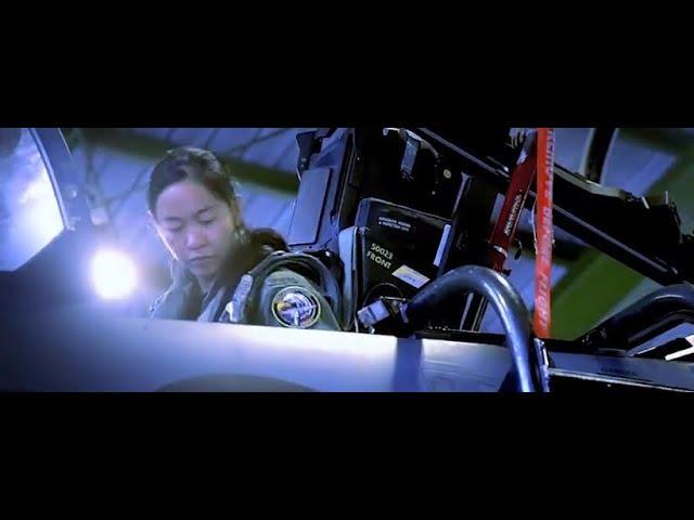 RSAF Female F-15 fighter pilot Major Nah Jinping strapped into cockpit