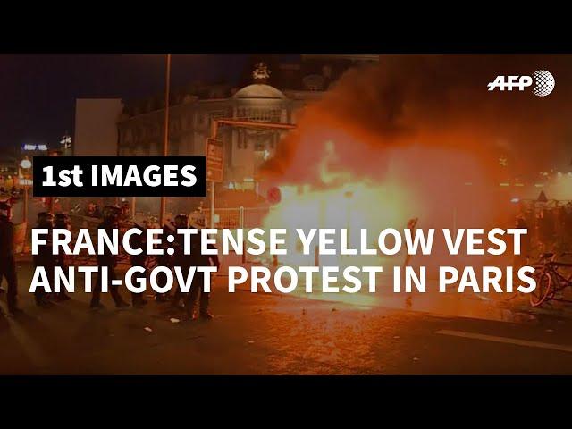 Fires, tear gas and arrests after yellow vest protest in Paris | AFP