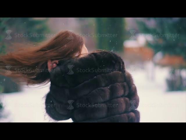 Brunette waist coat of brown fur with flying hair slow motion