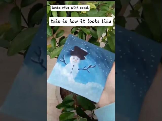 Painting snowman on canvas