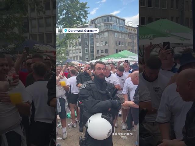 English fans sing to German police officer who looks like Southgate