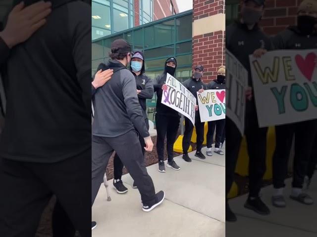 Whole hockey team greets Luke before his chemo at the hospital