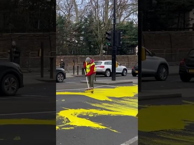 Protesters paint huge Ukraine flag outside Russian embassy in London