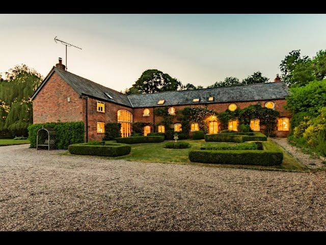 A magnificent 4,230 square feet Cheshire brick barn conversion, set in over 3 acres