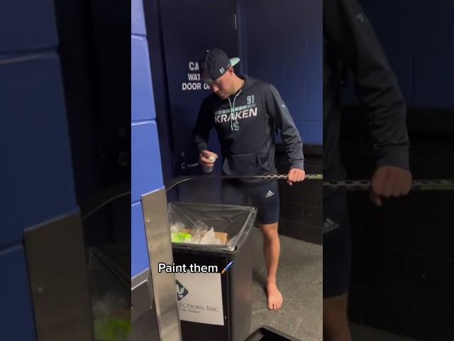 Hockey players prepping their sticks 