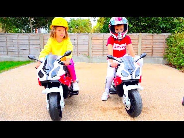 Kids play raicers on Two ride on toy motobikes