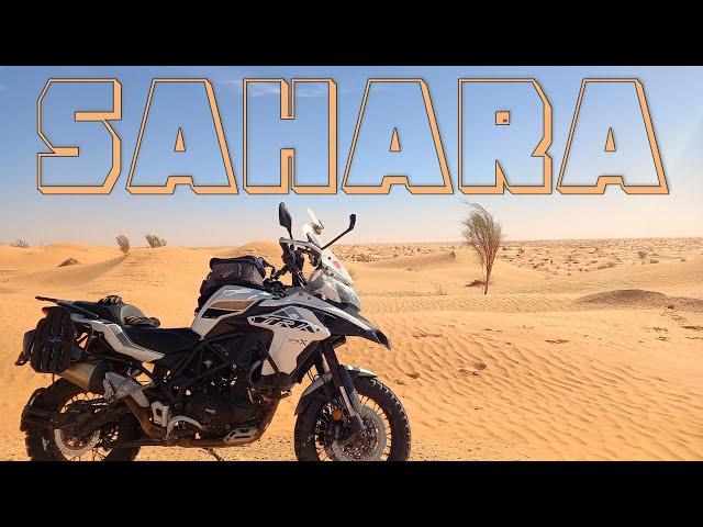 I drop my motorbike and risk getting stuck in the sand of the Sahara desert, Tunisia