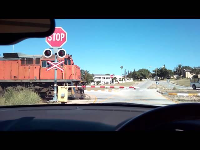 Spoornet Class 34 at railway crossing