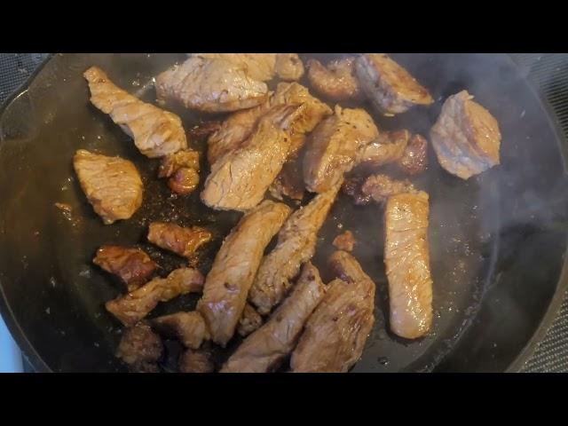 frying steak in a cast iron skillet