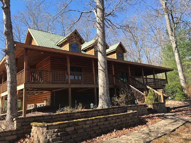 Beautiful Log cabin with detached garage and room above the garage