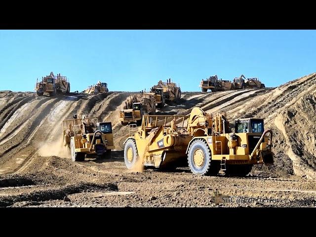 Glimpse at one of history's largest scraper mass grading projects. Caterpillar 657E 657G 651B