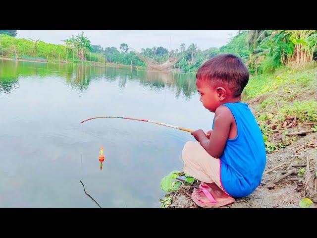 Little boy hunting big fish by rod ~ Traditional hook fishing in the river