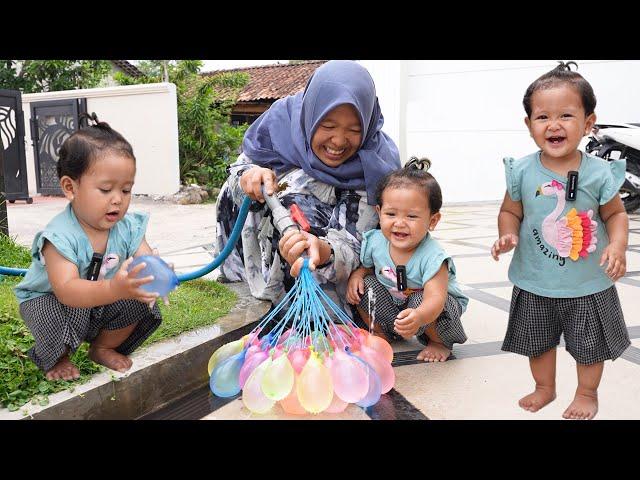 ARACELLI PLAYING WITH BREAKING COLORFUL WATER BALLOONS