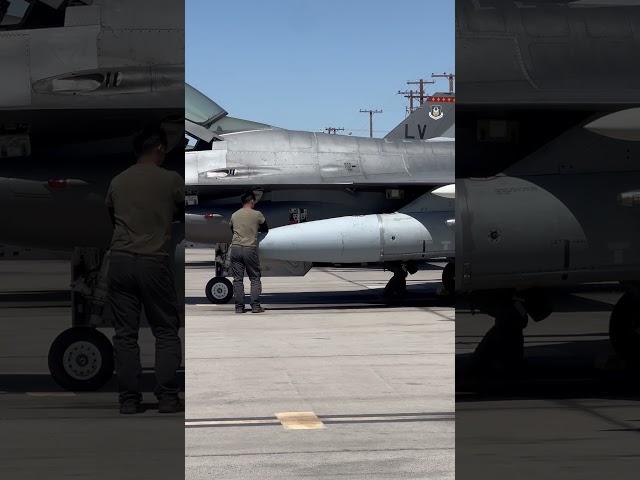 706th Aggressor Squadron pilot completes his walkaround of the F-16