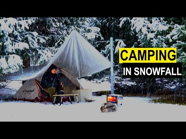 Hot tent camping in snowfall. I cook on a wood stove.Camping in a Heavy Snowstorm