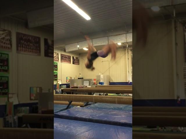 Standing Backtuck on Beam