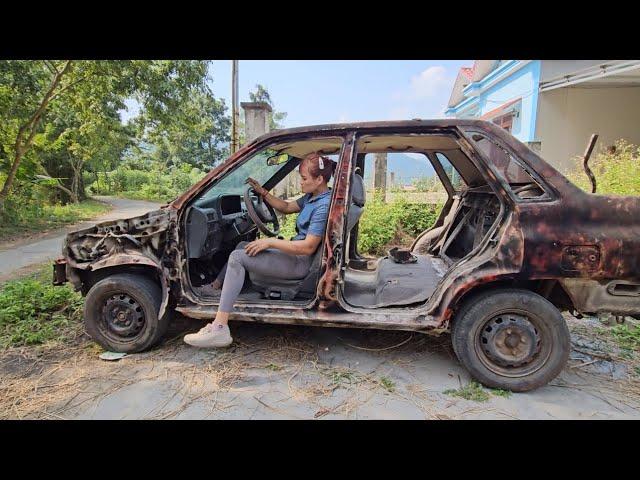 Girl repairs and restores old cars abandoned long ago.