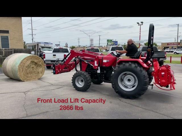 Mahindra 4540 Lifting a Round Bale