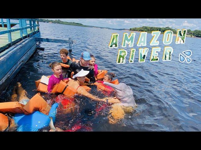 Swimming with pink dolphins in the Amazon river