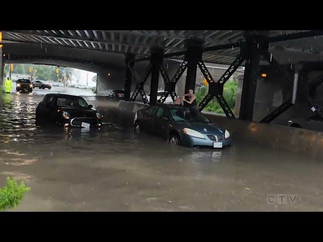 'My car is sinking': Woman climbs out of vehicle