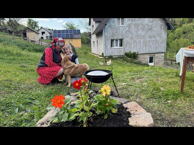 Rural life high in the mountains: cooking cabbage rolls with rice in a cauldron, peppermint tea