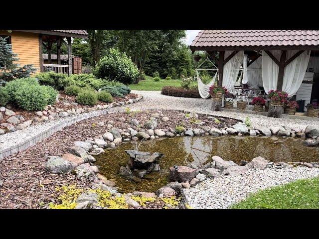 Views of the garden after the rain. Mediterranean garden. Moles ruin new flower beds...