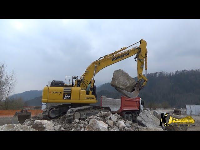 KOMATSU PC 290 11 EXCAVATOR LOADING BIG ROCKS ON TRUCK