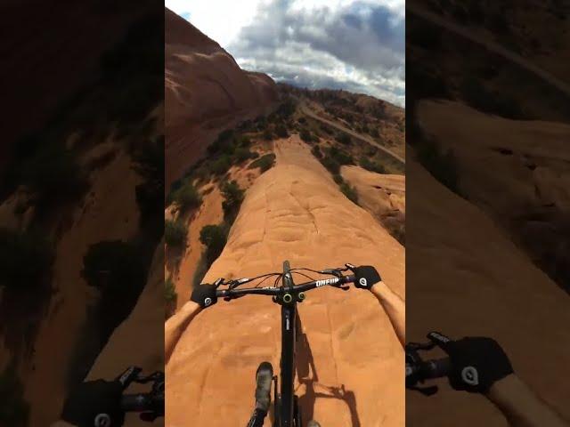 MTBer rides down a cliff with no climbing gear