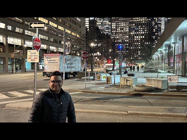 Fintech Nights: Exploring Wellington Street's Evening Charm Near the Iconic CN Tower, Toronto.