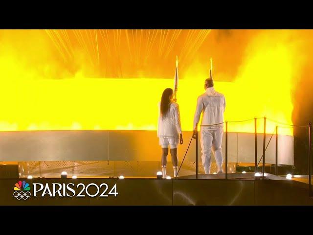 The Olympic Cauldron is lit at the 2024 Paris Olympics Opening Ceremony | NBC Sports