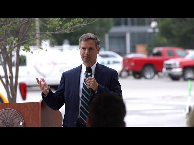 First National Bank's Joel Jensen speaks at the ribbon cutting for Brickline at The Mercantile