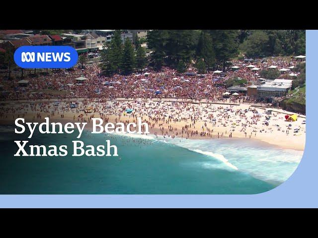 Thousands pack Sydney beach for 'Orphan's Christmas' | ABC NEWS