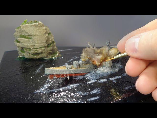 DIORAMA WITH A SINKING SHIP.